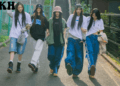 a group of women walking on a street